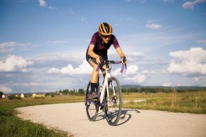 Cyclist riding a bicycle on a rural road